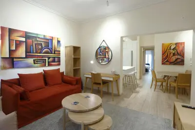 a living room with a couch and a table at Charming City Centre Flat Kolonaki in Athens