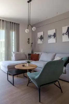a living room with a couch and a table at Athens Luxury in Athens