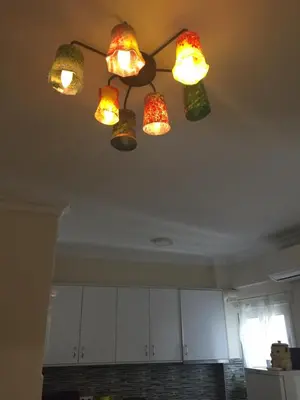 a group of lights hanging from a ceiling at Athens beautiful SUITE by Gela in Athens