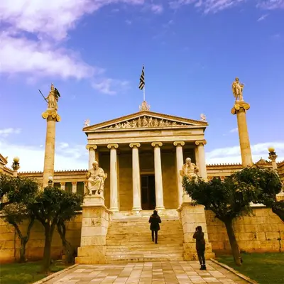 a building with a flag on top of it at Athens beautiful SUITE by Gela in Athens