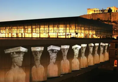 a lit up building with a bunch of glass bottles at Athens beautiful SUITE by Gela in Athens