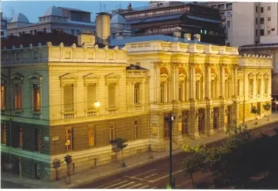 a large yellow building on the side of a street at Athens beautiful SUITE by Gela in Athens