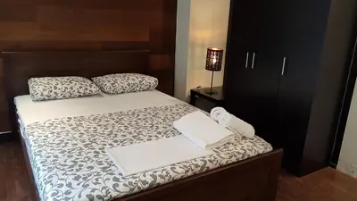 a bedroom with a bed with two pillows on it at Errathens Cherry and Berry Apartments - Athens Center in Athens