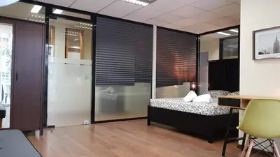 a bedroom with a bed and a desk in a room at Errathens Cherry and Berry Apartments - Athens Center in Athens