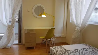 a bedroom with a bed and a desk and a mirror at Errathens Cherry and Berry Apartments - Athens Center in Athens