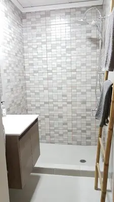 a bathroom with a shower with a counter and a sink at Errathens Cherry and Berry Apartments - Athens Center in Athens