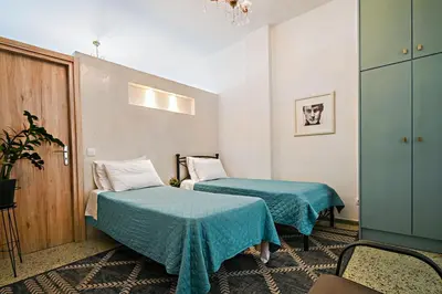 a room with two beds in a room at Urban Art Experience with Acropolis View in Athens