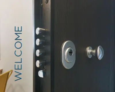 a black door with silver knobs on it at Urban Art Experience with Acropolis View in Athens
