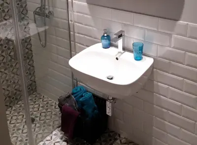 a bathroom with a sink and a shower at New stylish Kolonaki flat in Athens