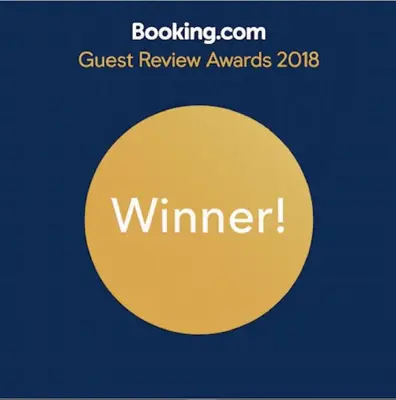 a yellow circle with the text guest review awards at Apartment 