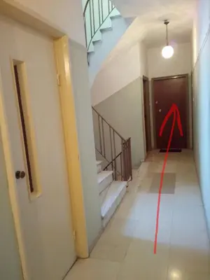 a room with stairs and a red string on the floor at Apartment 