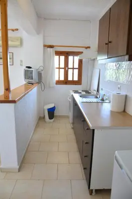 a kitchen with a sink and a counter top at Vagia Beach Apartments, Aegina Island in Vaia