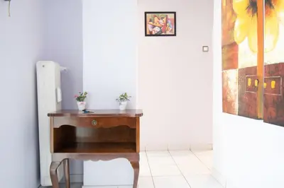 a desk in a room with a painting on the wall at Cozy Flat in Heart of Acropolis in Athens