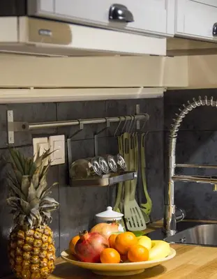 a plate of fruit on a counter in a kitchen at A Gift in the Heart of Monastiraki A in Athens
