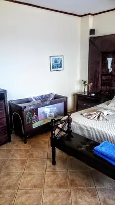 two twin beds in a room with at Villa Sunrise Lagonisi in Lagonissi