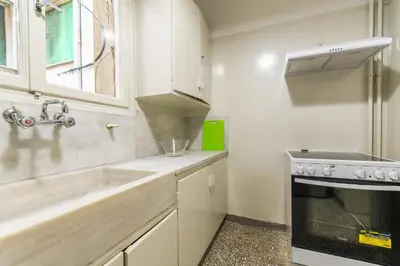 a kitchen with a sink and a stove at Victoria Queens Paradise Apartments in Athens