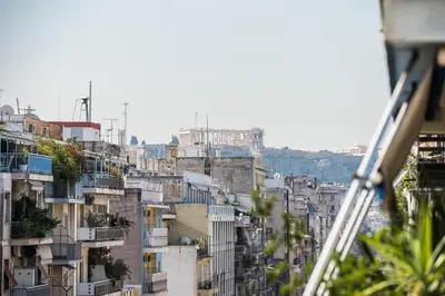 a view of a city with buildings at Victoria Queens Paradise Apartments in Athens