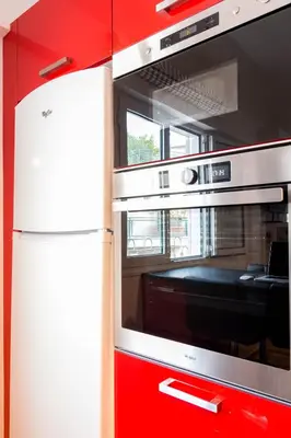 a kitchen with a refrigerator and a microwave at Martin’s Akropolis loft in Athens