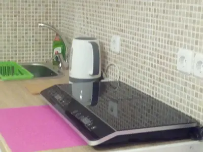 a coffee maker sitting on a counter next to a sink at New studio next to metro for 2 people in Athens