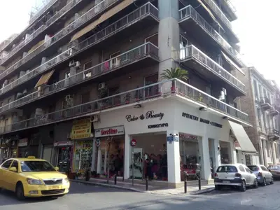 a building on a street with cars parked in front of it at New studio next to metro for 2 people in Athens