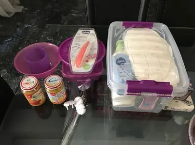 a plastic container with food and utensils on a table at 2BDR OlympianZeus Apt with Netflix in Athens