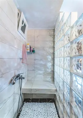a bathroom with a shower with a sink at Athena's Comet in Athens
