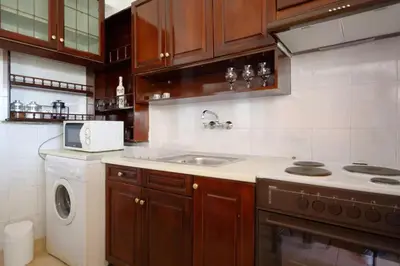 a kitchen with a sink and a washing machine at Helen house in Athens