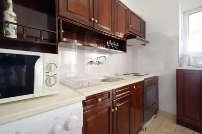 a kitchen with a sink and a microwave at Helen house in Athens