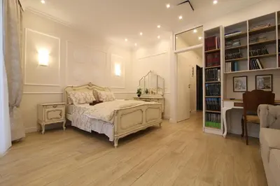 a bedroom with a bed and a book shelf at Luxurious Athenian Apartment in Athens