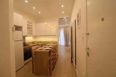 a kitchen with a large island in the middle at Luxurious Athenian Apartment in Athens