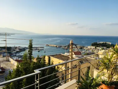 a view of the ocean from a balcony at Piraeus Lux Secret in Piraeus