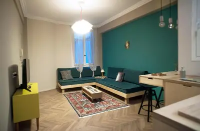 a living room with a couch and a table at Acron of Plaka by YHA in Athens