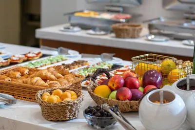 a buffet with baskets of fruit and other foods at B4B Athens Signature Hotel in Athens