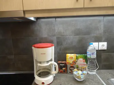 a coffee maker on a counter in a kitchen at Athenian Center Athens Kolonaki in Athens