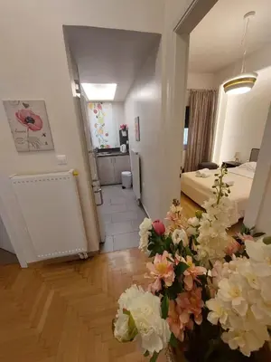 a living room with flowers on the floor at Athenian Center Athens Kolonaki in Athens