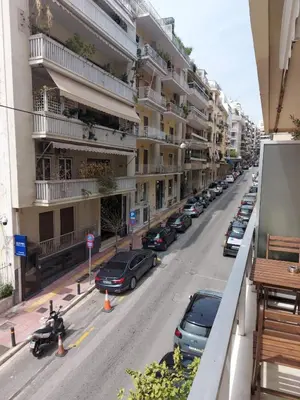 a view of a street with cars parked in front of buildings at Athenian Center Athens Kolonaki in Athens