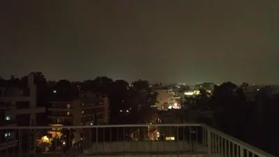 a view of a city at night at Theo's loft in Athens