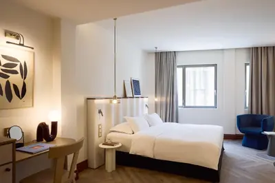 a hotel room with a bed and a desk at A for Athens in Athens