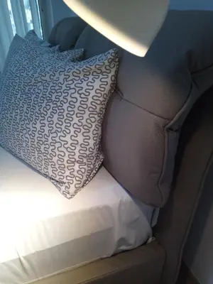 a bed with a pillow and a pillowcase at The New Studio Suite Near Akropolis in Athens