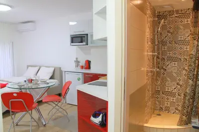 a kitchen with a table and a small table and chairs at The New Studio Suite Near Akropolis in Athens