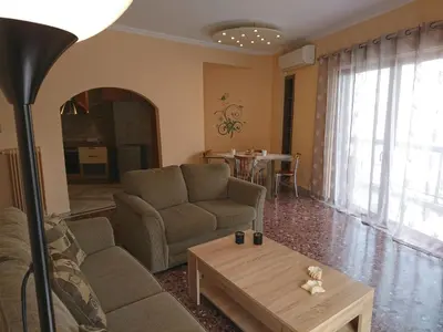 a living room with a couch and a table at Marianas Inn in Athens