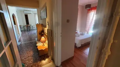 a view of a room with a bedroom and a bed at Marianas Inn in Athens