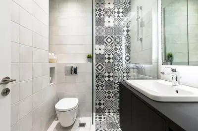 a bathroom with a toilet and a sink at Acropolis Heart 1BD Apartment in Plaka by UPSTREET in Athens