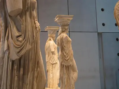 two statues of two women in a museum at Artdecoathens in Athens