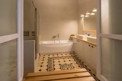 a bathroom with a tub and a sink and a bath tub at Artdecoathens in Athens