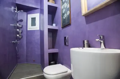 a purple bathroom with a sink and a toilet at Modern-Vintage apartment by Acropolis museum in Athens