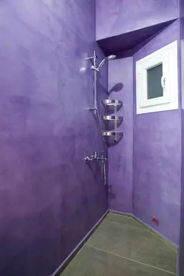 a purple bathroom with a shower and a window at Modern-Vintage apartment by Acropolis museum in Athens