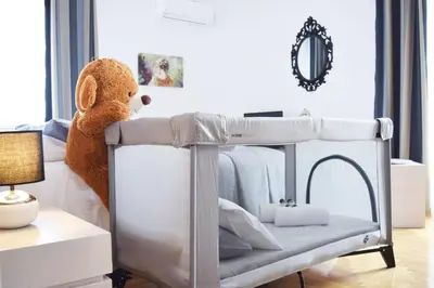 a teddy bear sitting on top of a bunk bed at Zeus by Heloni Apartments in Athens