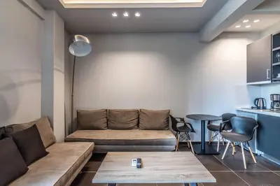 a living room with a couch and a table at Furla Apartments Athens in Athens