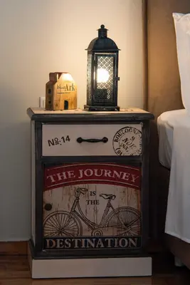 a nightstand with a clock and a lantern on top at Blue Ark Stylish Athens in Athens